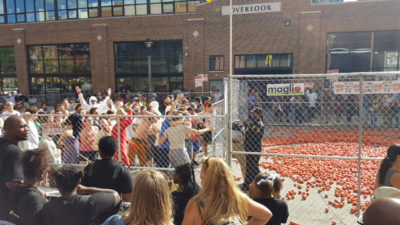 Tomato Romp celebration with a cage full of tomatoes