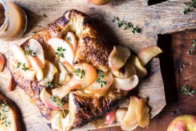 Puff pastry with apples on a wood cutting board